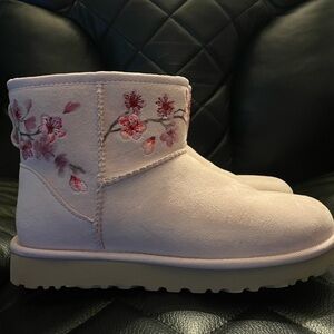 Light pink floral trim. Like new. Barely worn.